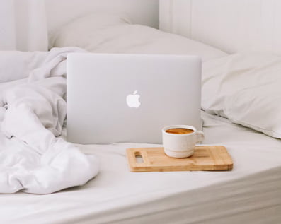 Macbook on the bed